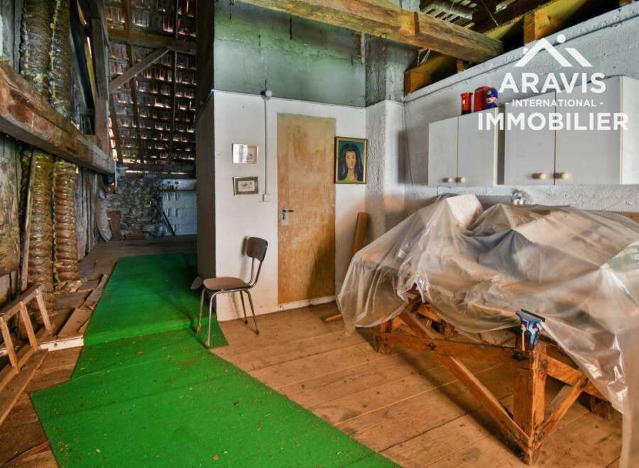 Discover the unique charm of this property, featuring a rustic interior with exposed wooden beams and a historic ambiance.