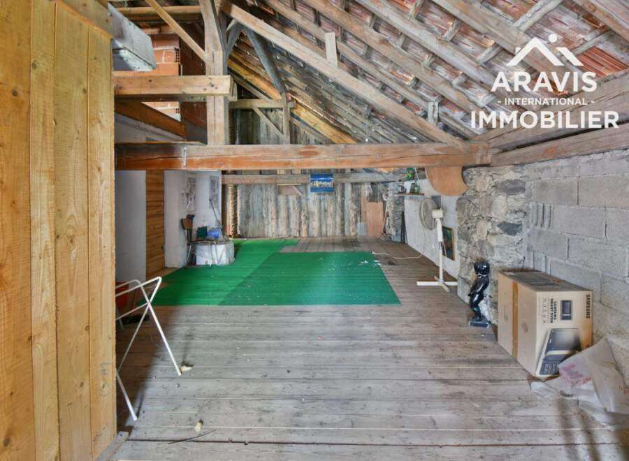 Discover the rustic charm of this unique property, featuring exposed wooden beams and a spacious interior.