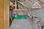 Discover the rustic charm of this unique property, featuring exposed wooden beams and a spacious interior.