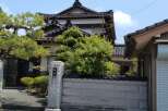 Discover the charm of this traditional Japanese property, featuring classic architecture and lush greenery.