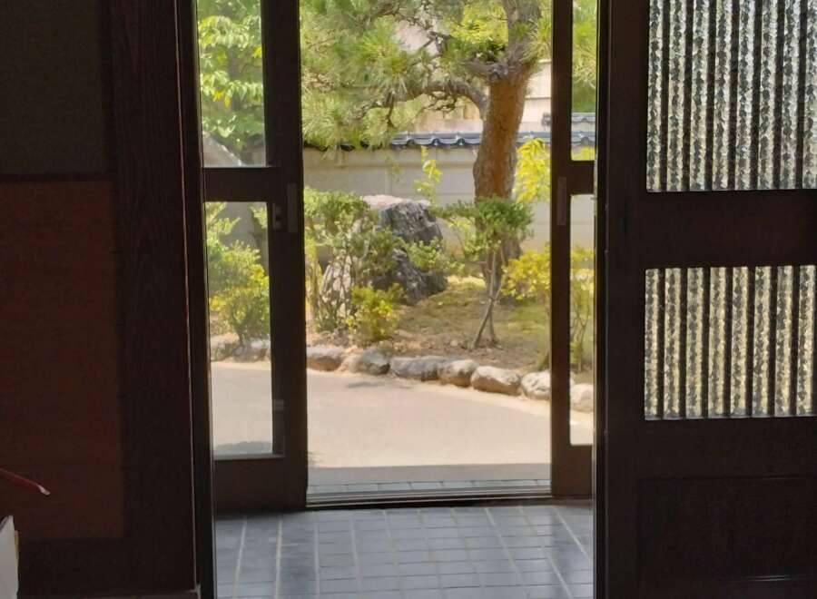 Step into tranquility with this stunning property, featuring a serene view of a meticulously landscaped garden.