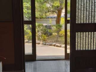 Step into tranquility with this stunning property, featuring a serene view of a meticulously landscaped garden.