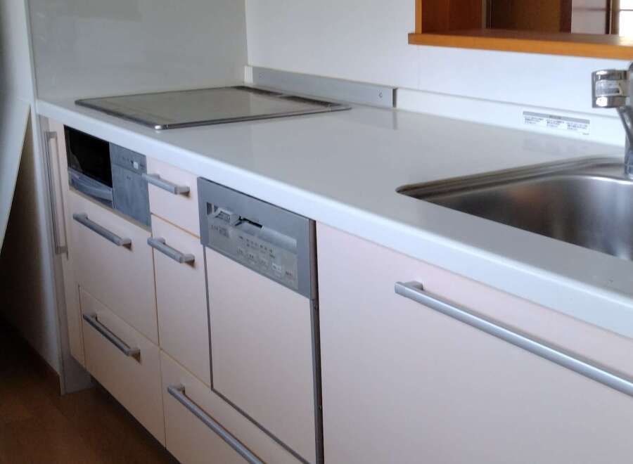 This modern kitchen features sleek cabinetry and stainless steel appliances, offering a stylish and functional space.