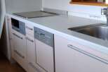 This modern kitchen features sleek cabinetry and stainless steel appliances, offering a stylish and functional space.