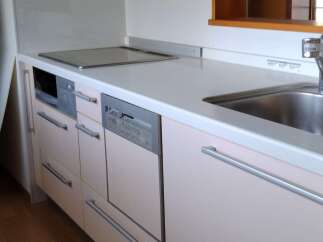 This modern kitchen features sleek cabinetry and stainless steel appliances, offering a stylish and functional space.