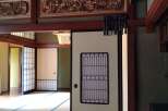 Step into a serene Japanese-style home with intricate wooden carvings and traditional sliding doors.