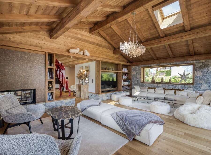 This luxurious living space showcases a stunning blend of rustic charm and modern elegance.