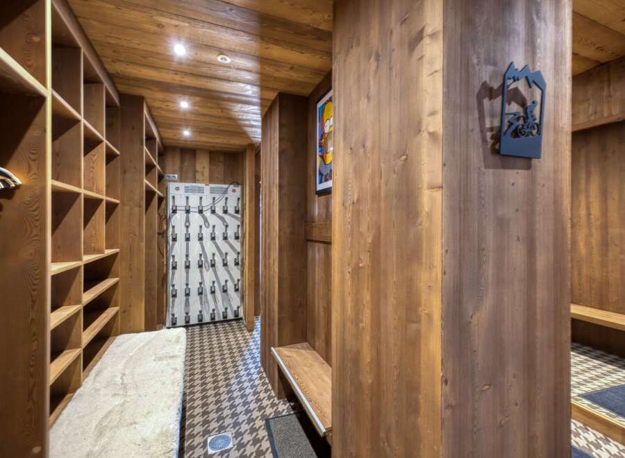 Step into a world of rustic charm with this stunning ski locker room.