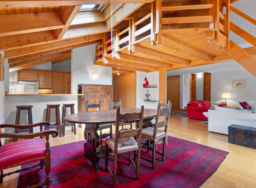 Discover the charm of this stunning property, featuring a unique architectural design with exposed wooden beams and a loft area.
