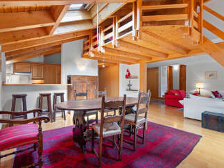 Discover the charm of this stunning property, featuring a unique architectural design with exposed wooden beams and a loft area.