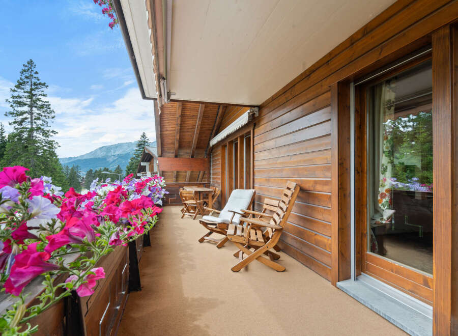 Enjoy breathtaking mountain views from this charming balcony.