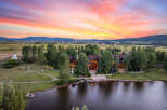 Experience luxury living in this stunning estate, featuring a grand residence nestled amidst a picturesque landscape.