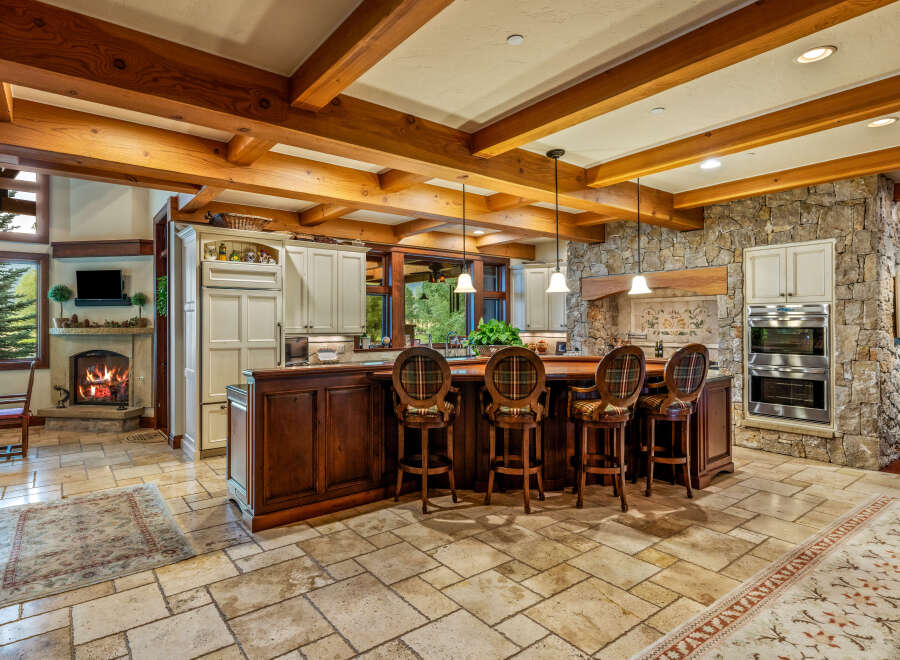 This stunning kitchen boasts a rustic yet elegant design, perfect for entertaining and everyday living.