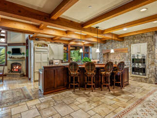 This stunning kitchen boasts a rustic yet elegant design, perfect for entertaining and everyday living.