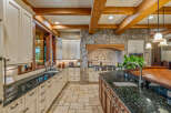 This stunning kitchen boasts a luxurious design with custom cabinetry and granite countertops.