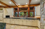 This stunning kitchen boasts a warm and inviting atmosphere, perfect for culinary creations and gatherings.