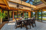 Experience luxury living in this stunning property, featuring a beautiful outdoor dining area.