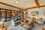 Step into luxury with this stunning living room, featuring a cozy sofa and elegant armchairs.