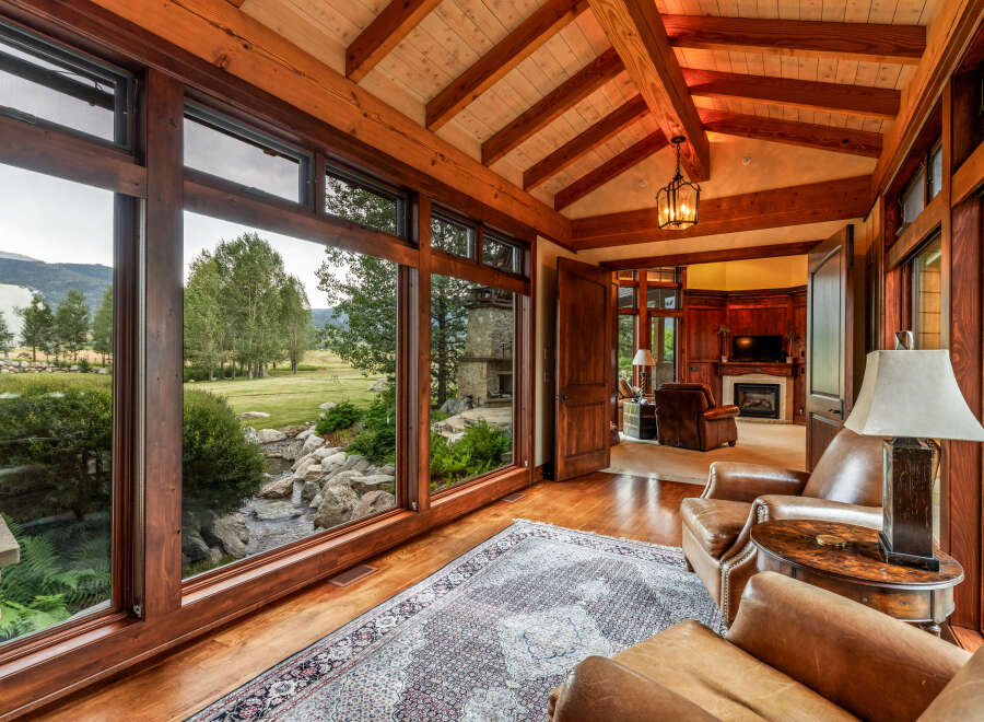 Experience luxury living in this stunning property, featuring expansive windows that frame breathtaking views of the surrounding landscape.