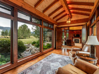 Experience luxury living in this stunning property, featuring expansive windows that frame breathtaking views of the surrounding landscape.