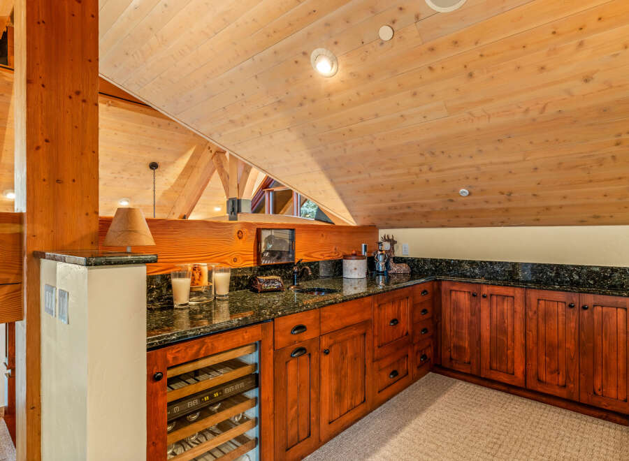 This stunning property boasts a custom-built bar area, perfect for entertaining guests.