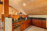 This stunning property boasts a custom-built bar area, perfect for entertaining guests.