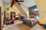 This charming bedroom boasts a cozy atmosphere with its two beds and inviting decor.