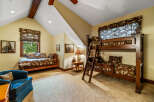 Step into this charming bedroom, featuring a cozy bunk bed and a comfortable single bed, perfect for accommodating guests or family.