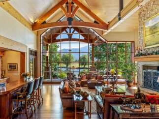Experience luxury living in this stunning property, featuring a spacious living area with a breathtaking view.