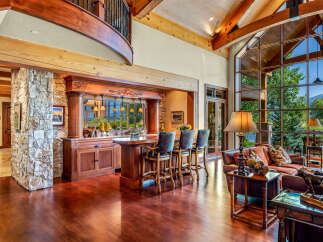 Experience luxury living in this stunning property, featuring a beautifully designed bar area perfect for entertaining.