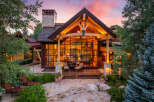 Experience luxury living in this stunning property, featuring a grand entrance with a stone pathway and lush landscaping.
