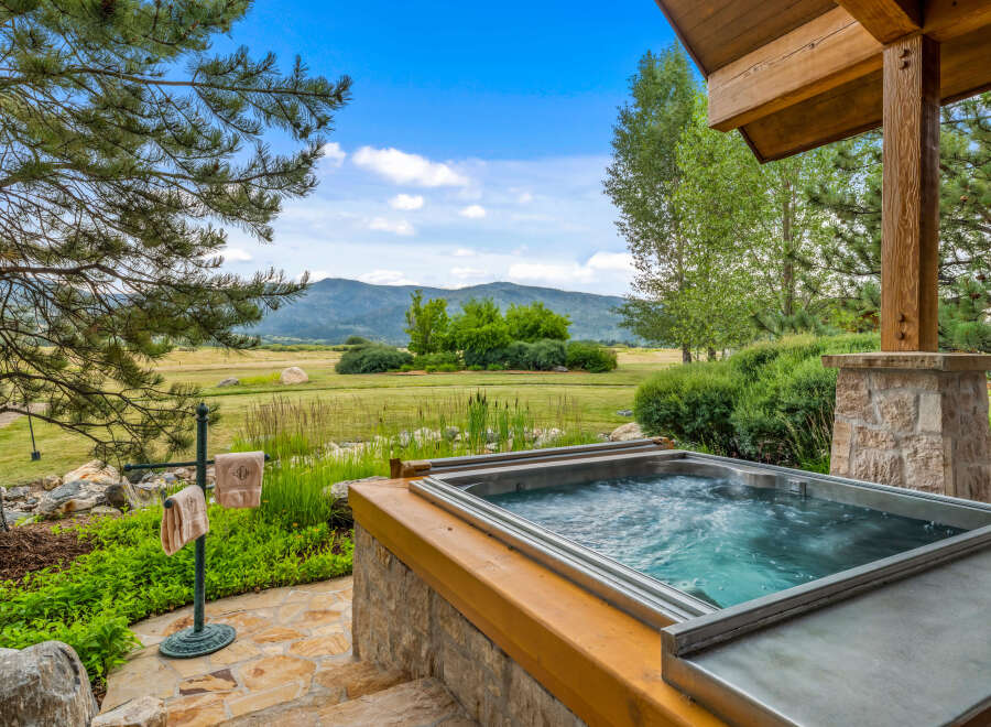 Experience luxury living with this stunning property featuring a private hot tub, perfect for relaxation.