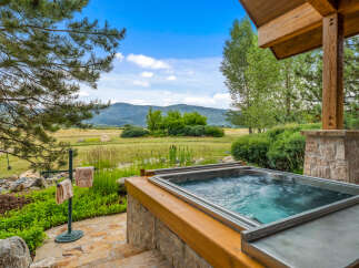 Experience luxury living with this stunning property featuring a private hot tub, perfect for relaxation.