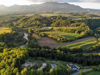 Discover the tranquility of this stunning property, nestled amidst lush greenery and rolling hills.