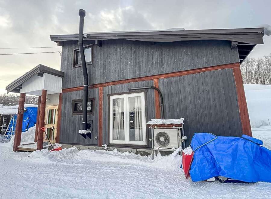 Discover this charming property nestled in a snowy landscape, perfect for a cozy retreat.