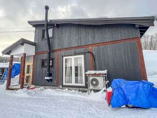 Discover this charming property nestled in a snowy landscape, perfect for a cozy retreat.