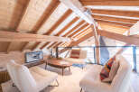 Experience the charm of this stunning loft-style living space, featuring exposed wooden beams and a cozy ambiance.