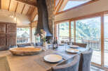 Experience luxury living in this stunning property, featuring a spacious dining area with breathtaking mountain views.