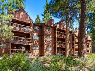 Discover a charming condo nestled in a serene, wooded setting.