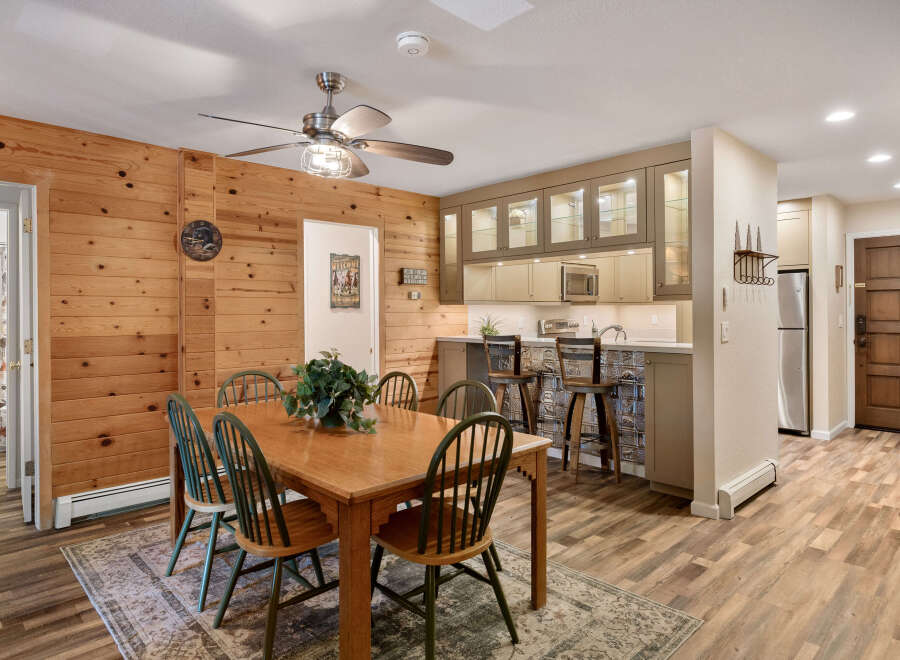This charming property boasts a warm and inviting dining area, perfect for gatherings.