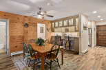 This charming property boasts a warm and inviting dining area, perfect for gatherings.