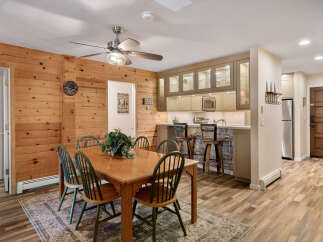 This charming property boasts a warm and inviting dining area, perfect for gatherings.