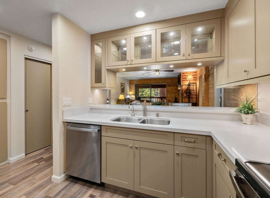 This stunning kitchen boasts a modern design with sleek countertops and ample cabinet space.