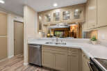 This stunning kitchen boasts a modern design with sleek countertops and ample cabinet space.