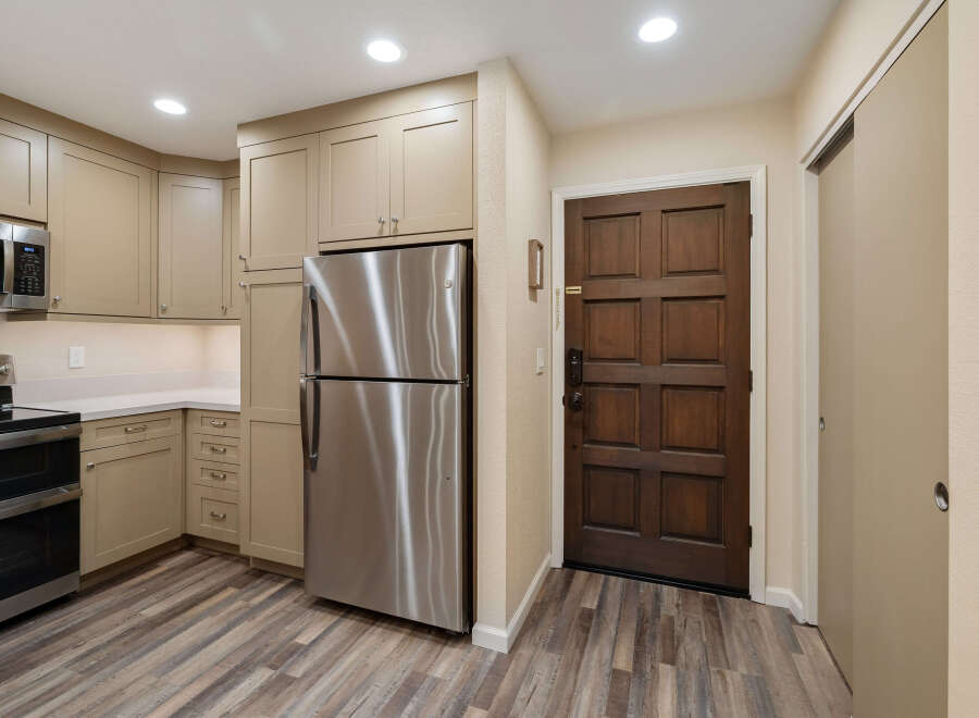 Step into this inviting kitchen, featuring modern stainless steel appliances and ample cabinet space.