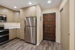 Step into this inviting kitchen, featuring modern stainless steel appliances and ample cabinet space.