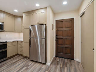 Step into this inviting kitchen, featuring modern stainless steel appliances and ample cabinet space.