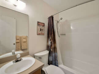 This charming bathroom features a clean and inviting design.