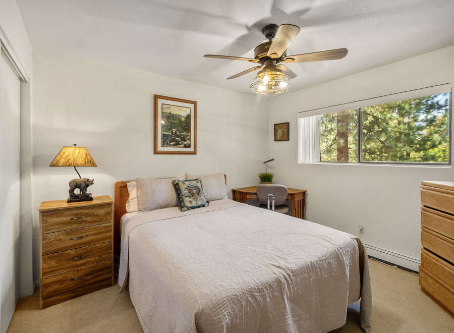 This cozy bedroom offers a serene retreat with its warm, inviting ambiance.