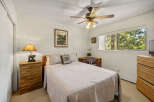 This cozy bedroom offers a serene retreat with its warm, inviting ambiance.